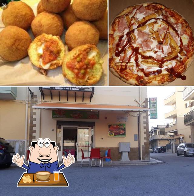 La foto di cibo e interni da Pizzeria "La Vespa"