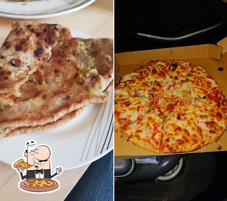 Order pizza at Madina Roti House & Pizza