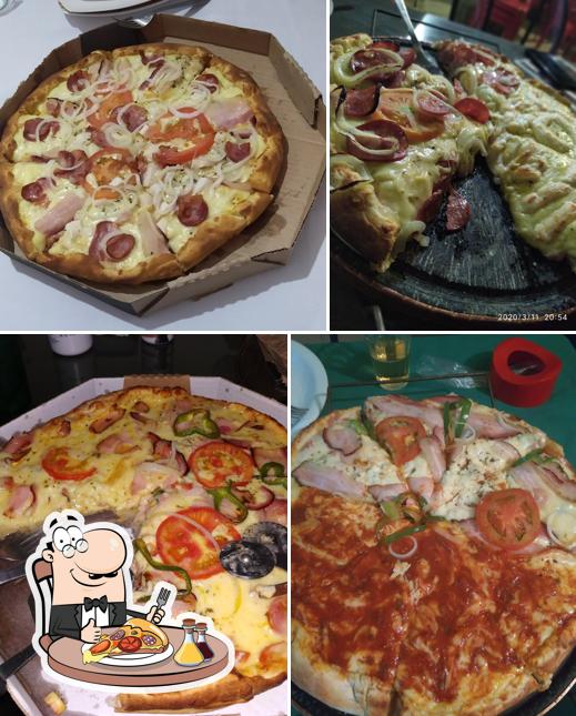 Escolha pizza no Pizzaria Casa de Pedra