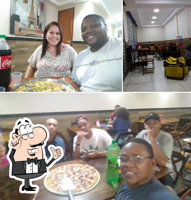 O interior do Kellu´S Lanchonete E Pizzaria