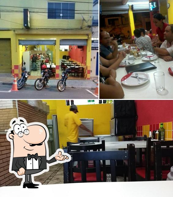 O interior do Pizzaria Magnata