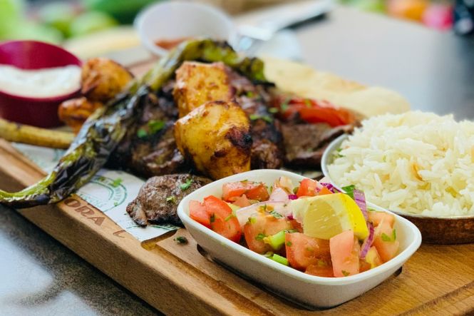 Cooked food on a white ceramic plate. Photo by Faisal on Unsplash