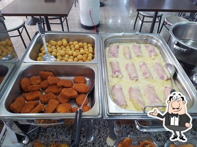 Sente em uma das mesas no Apetittus Restaurante