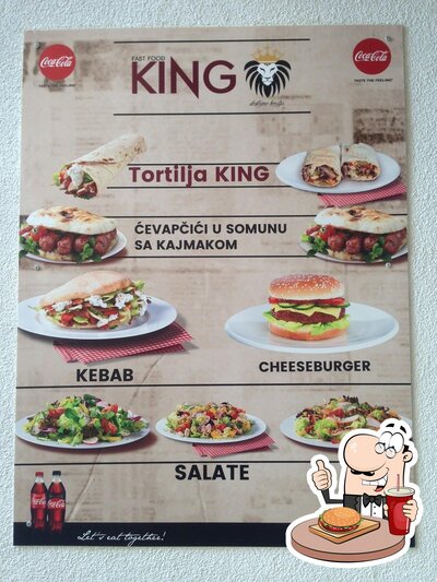 Gustati uno dei tipi di hamburger proposti al ristorante Fast Food KING