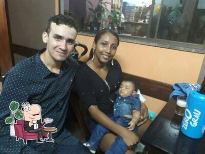 Sente em uma das mesas no Rustikale Pizzaria