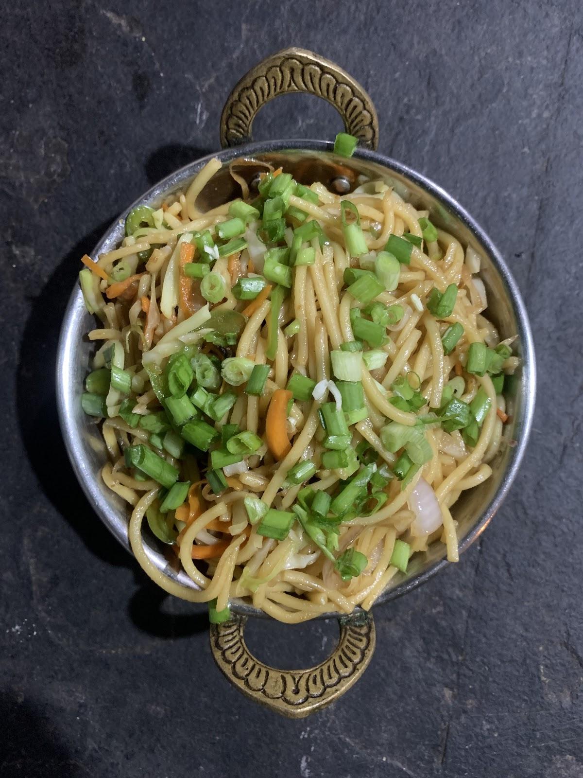 Flying wok by Elu's Place